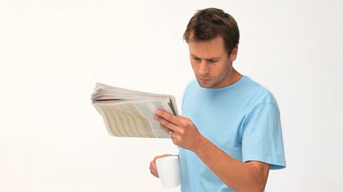 Man Enjoying Newspaper and Coffee in Relaxed Moment