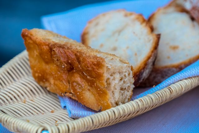 Freshly Baked Bread Slices in Wicker Basket - Download Free Stock Photos Pikwizard.com
