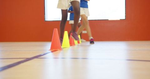 School Gym Footwork Training with Cones Enhancing Athletic Skills