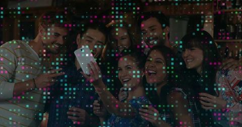 Joyful Friends Taking Selfie Celebrating at Lively Night Out