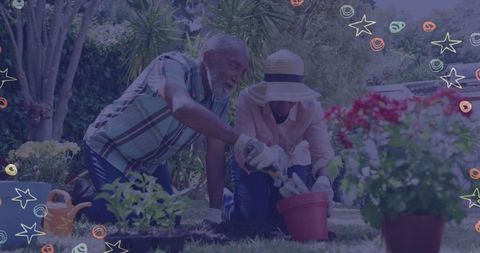 Joyful Senior African American Couple Gardening Together Outdoors