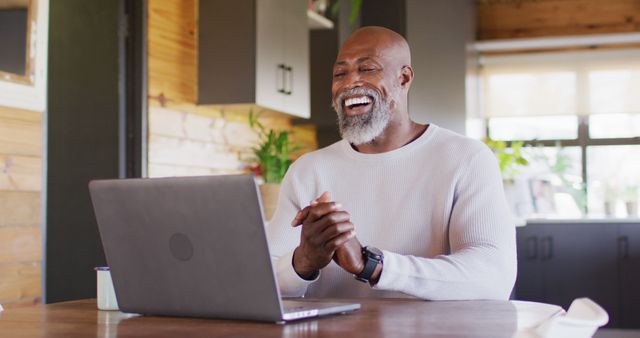 Smiling Mature Man Enjoying Video Call on Laptop at Home - Download Free Stock Images Pikwizard.com