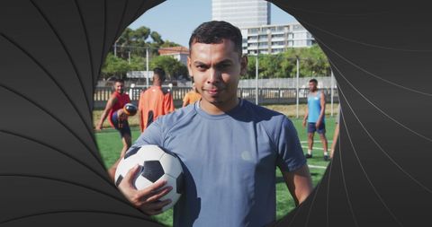 Biracial Athletes Training on Soccer Field Confidently