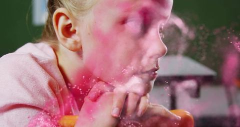 Contemplative girl leaning on chair with pink pastel dust, soft-focus portrait