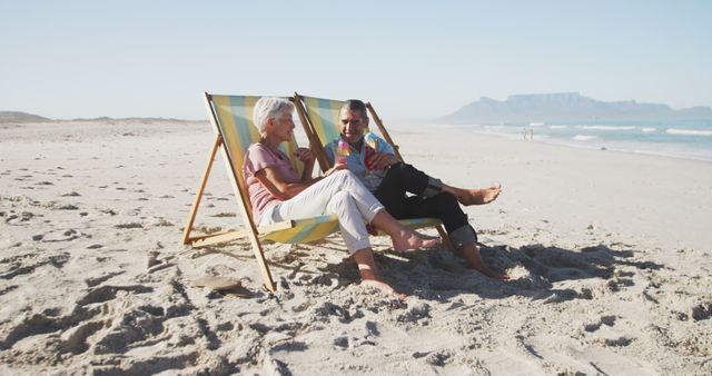 Senior Couple Relaxing in Deck Chairs on Beach - Download Free Stock Images Pikwizard.com