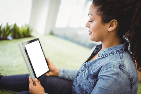 transparent screen showing woman using tablet in relaxing park atmosphere - Download Free Stock Videos Pikwizard.com