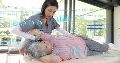 Chiropractic therapist performing spinal adjustment with AR health analytics overlays