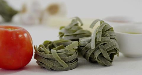 Gourmet Spinach Pasta Nests with Tomato and Garlic