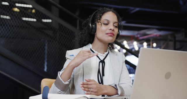 Businesswoman Participating in Video Conference Call in Modern Office - Download Free Stock Images Pikwizard.com