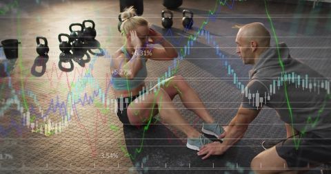 Woman doing situps with trainer holding feet and financial charts overlay, fitness analytics concept