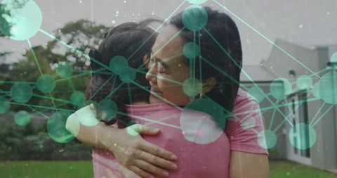 Hugging mother and daughter with green network overlay conveying family connection