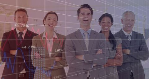 Confident executive team crossing arms with translucent finance charts overlay