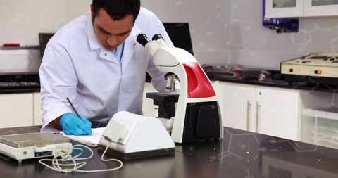 Scientist Analyzing Data in Laboratory Using Microscope - Download Free Stock Images Pikwizard.com
