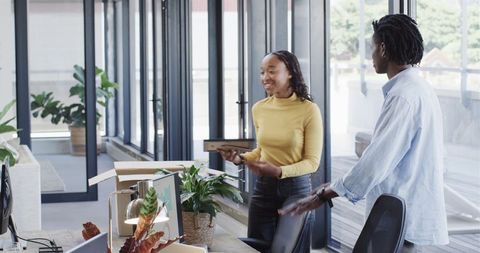Smiling Women Collaborating in Modern Office, Strengthening Professional Ties