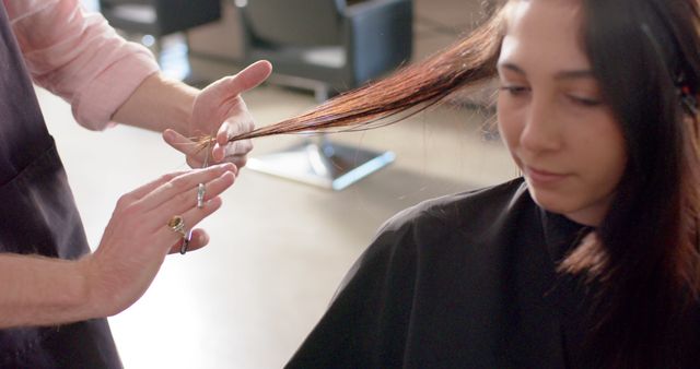 Professional Hair Stylist Trimming Young Woman's Long Hair at Salon - Download Free Stock Images Pikwizard.com