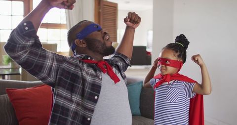 Father Daughter Bonding Wearing Superhero Costumes
