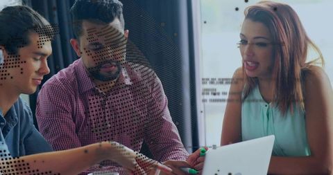 Team of Developers Collaborating on Laptop Presentation in Office