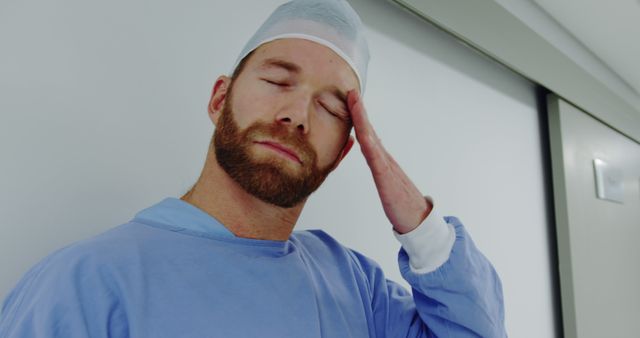 Exhausted Surgeon in Scrubs Taking a Break - Download Free Stock Images Pikwizard.com