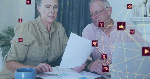 Senior couple discussing finances with social media connections network