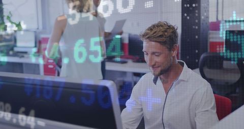 Businessman Analyzing Financial Data on Computer Screen