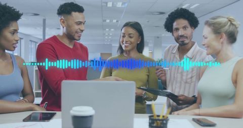 Diverse Team Collaboration with Digital Interface in Office Environment