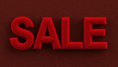 Plush velvet sale typography in crimson with dramatic studio lighting and drop shadows
