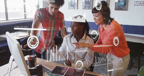 Team Collaborating on Data Analysis in Modern Office Environment