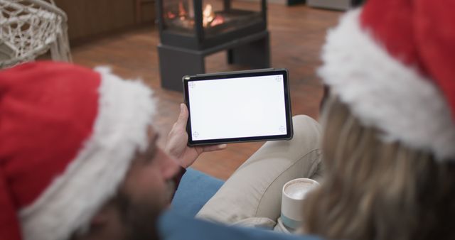 Couple Enjoying Christmas Holidays Relaxing with Tablet - Download Free Stock Images Pikwizard.com