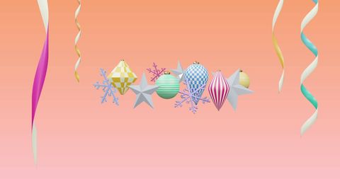 Colorful christmas ornaments on pink gradient background