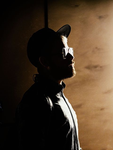 Mysterious man wear hat and leather jacket in shadowy light - Download Free Stock Photos Pikwizard.com