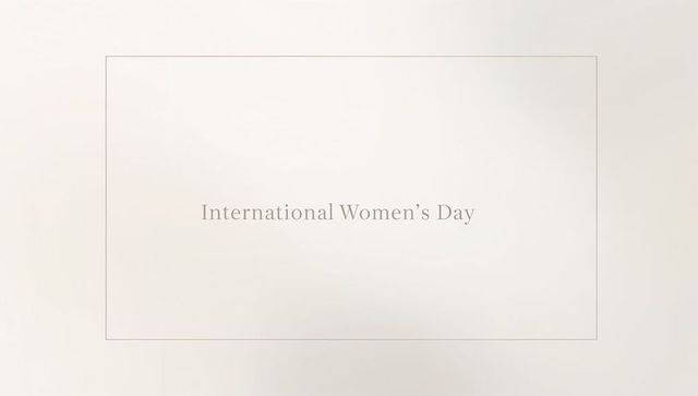 Celebrating international women's day with minimalist serif framed panel on beige texture