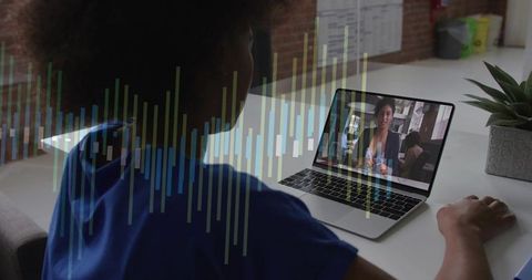 Remote team collaborating on video call at modern desk with laptop and waveform overlay