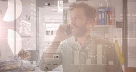 Businessman Analyzing Data During Phone Call