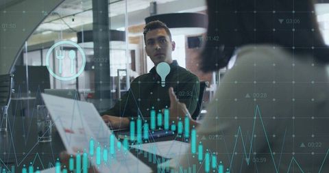 Business Meeting with Data Visualizations in Modern Office