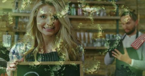 Barista Crafting Coffee, Smiling Woman Holding Chalkboard in Trendy Café