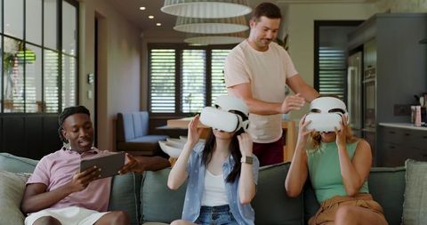 Friends Enjoying Virtual Reality Headsets in Modern Living Room