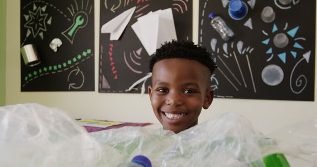 Smiling Boy In Classroom With Recycling Projects - Download Free Stock Images Pikwizard.com