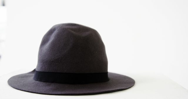A classic black fedora hat is showcased against a white background, with copy space - Download Free Stock Photos Pikwizard.com