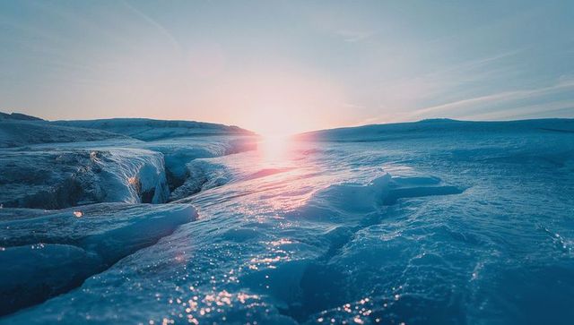 Mesmerizing Polar Sunrise Over Icy Crevasse Landscape