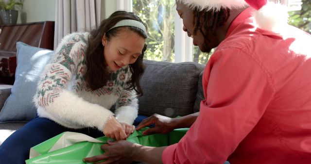 Father and Daughter Wrapping Christmas Gifts Together - Download Free Stock Images Pikwizard.com