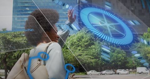 Futuristic technology overlay with businesswoman interacting