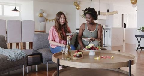 Diverse Female Couple Enjoying Birthday Celebration at Home