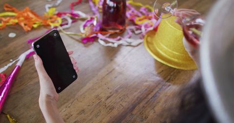 Celebratory new year video call, woman holding smartphone