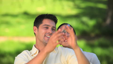 Smiling Couple Taking Selfie in Green Park