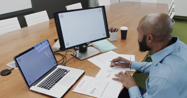 Businessman Analyzing Financial Reports Working in Office - Download Free Stock Images Pikwizard.com