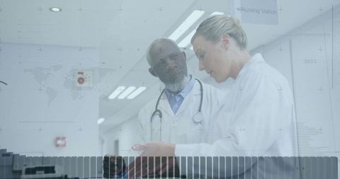 Medical professionals analyzing lab samples in hospital hallway