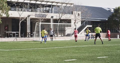 Soccer practice under clear sky with dedicated players