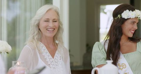 Joyful Friends Celebrating with Smiles at Wedding Event