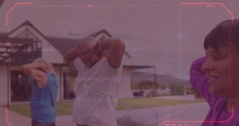 Happy Senior Adults Doing Arm Stretches Outside Modern House