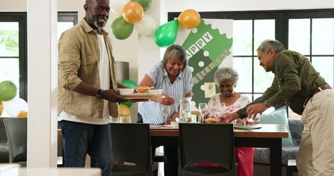 Happy Senior Friends Celebrating Retirement at Home